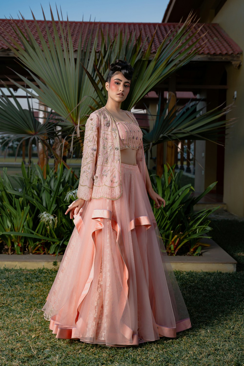 Pink lehenga with embroidered blouse and sheer jacket